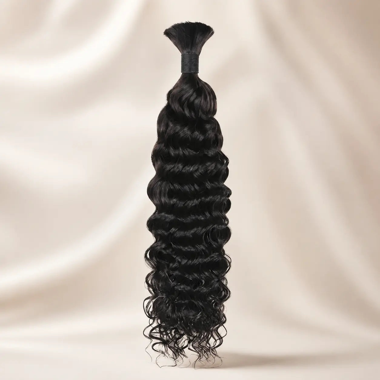Natural Black 1B deep wave virgin human braiding hair bundle on a silk background